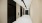 a hallway with black doors