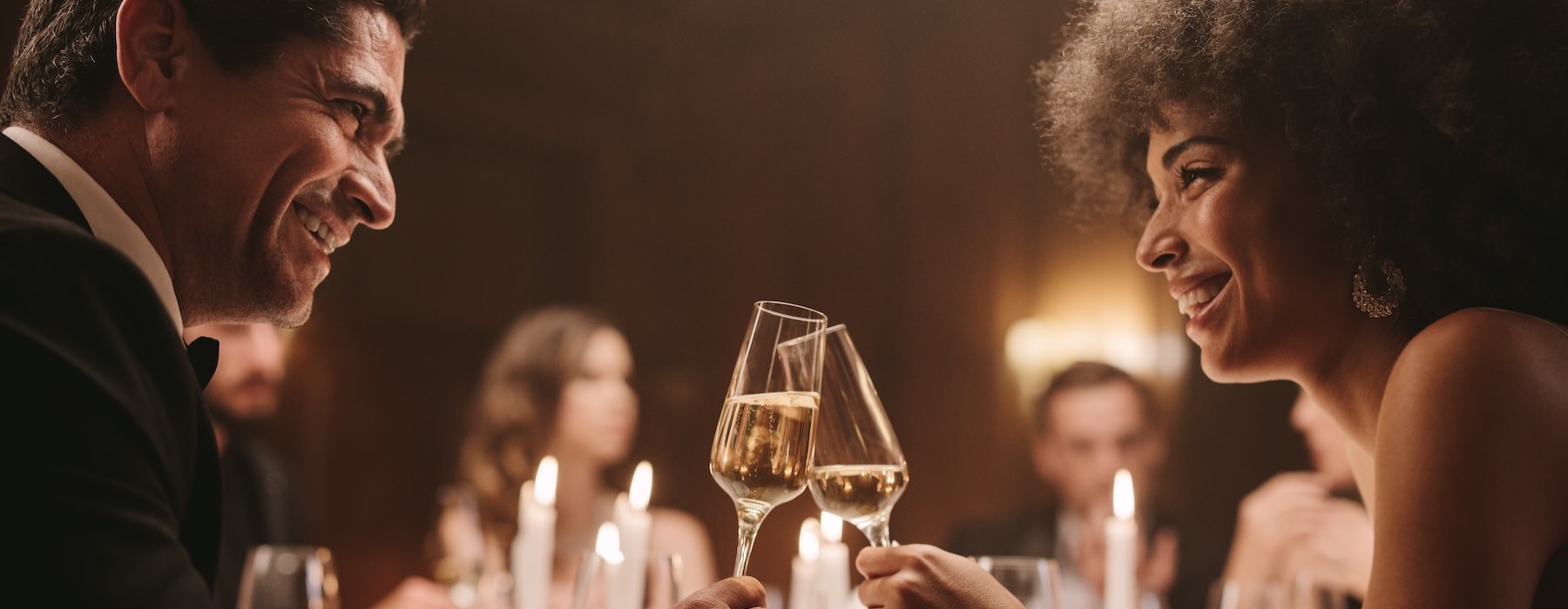 a man and a woman toasting each other
