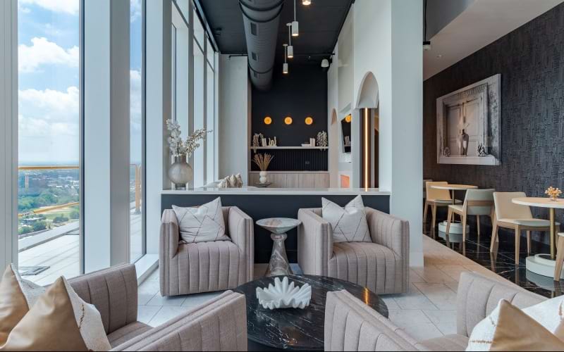 club lounge with seating and tables with chairs