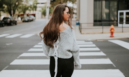 a woman walking on a street